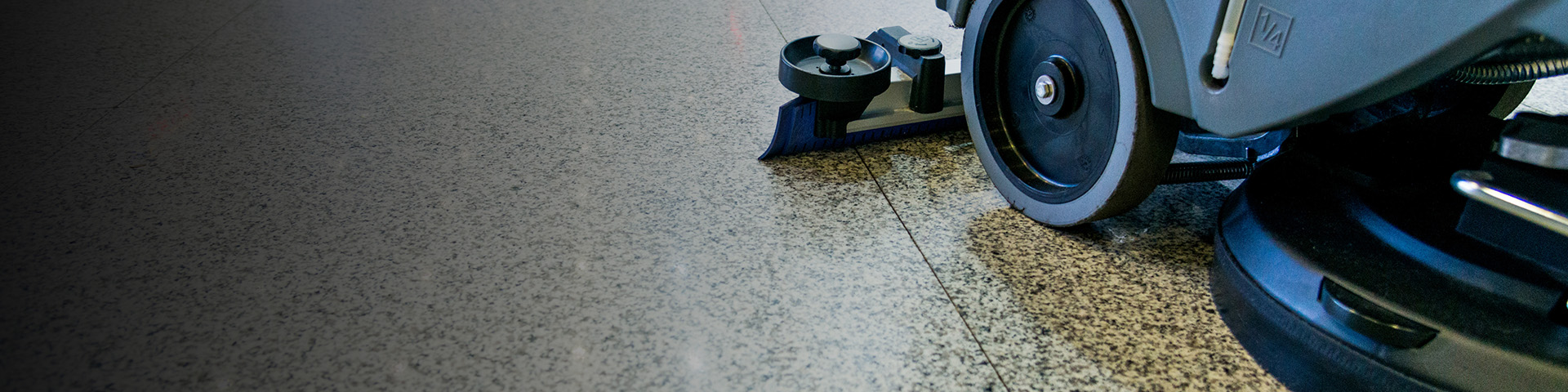 Floor scrubber in action cleaning and waxing floor